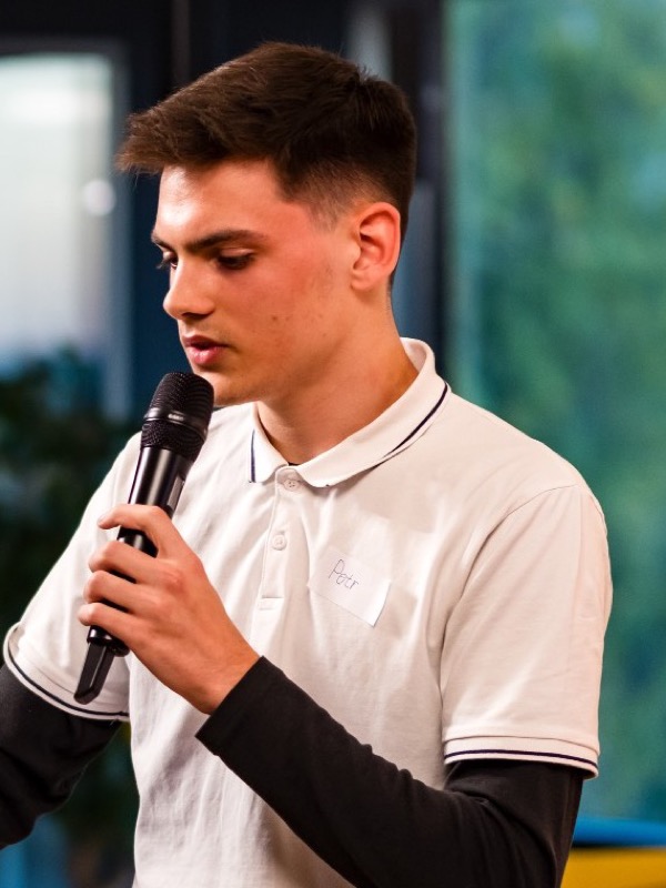 Petr Kynčl presenting on stage